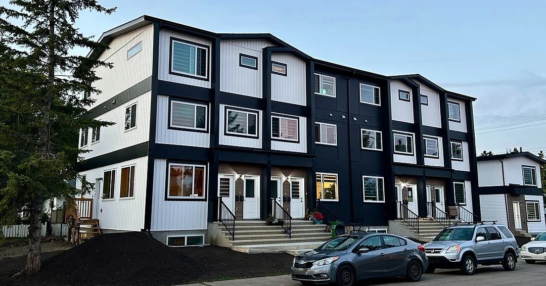 Completed eight-unit multifamily building in Edmonton at dusk